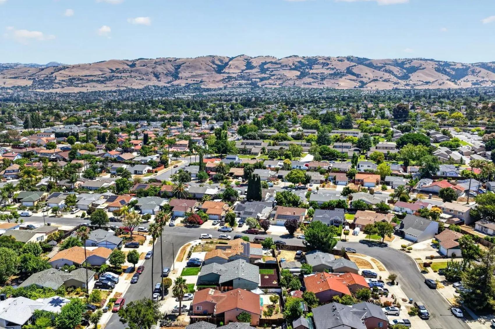 Aerial view over San Jose neighborhoods toward the East Foothills